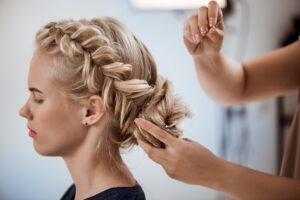 female-hairdresser-making-hairstyle-blonde-woman-beauty-salon-scaled.jpg