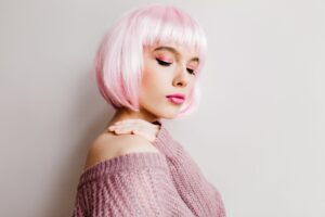 spectacular-young-lady-stylish-periwig-standing-with-eyes-closed-pretty-white-girl-wears-pink-wig-posing-soft-purple-sweater-scaled.jpg